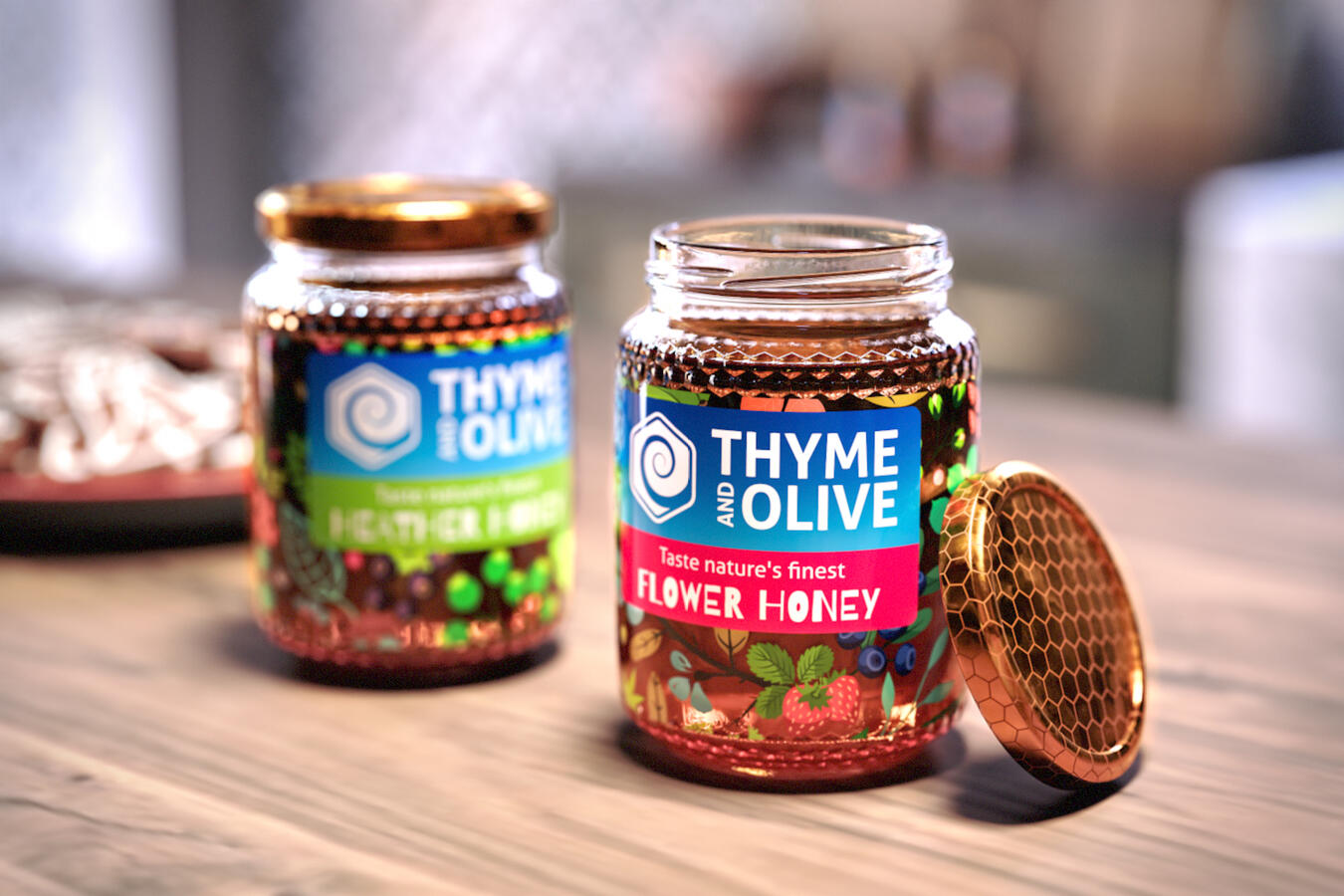 Two glass jars of Thyme and Olive brand honey, one labeled Flower Honey with its honeycomb-patterned lid open, on a wooden surface.